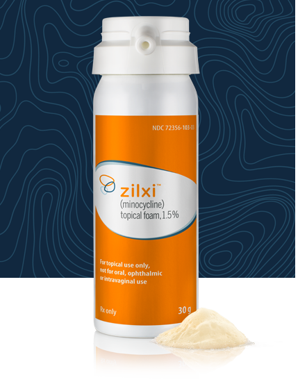 A bottle of foam with an orange Zilxi label stands in front of a textured blue background with a dollop of foam below it